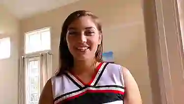 Sexy cheerleader, Vivian Taylor is having a phone call, while her guy is watching her ass