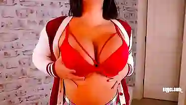 Big titted brunette, Bry Cee is wearing a sexy school uniform and rubbing her pussy
