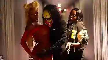 Watch these two busty babes go wild on a clown with their butts!