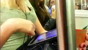 Blonde downblouse cleavage on subway train